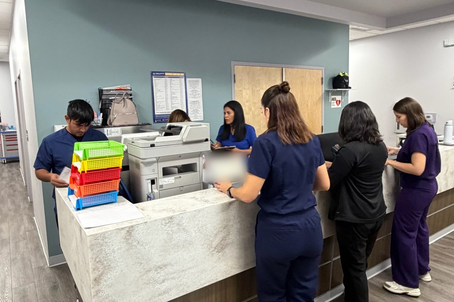 The Transmountain Primary Care team at the front desk