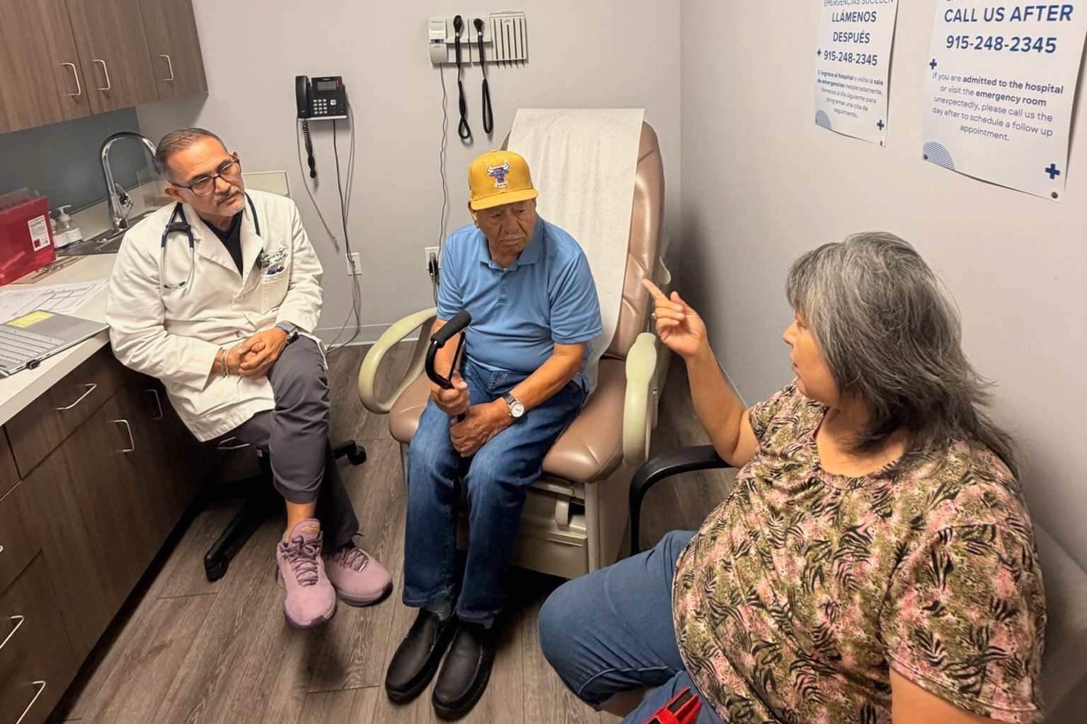 Dr. Jose A. Marin talking with a patient and a family member at Transmountain Primary Care in El Paso