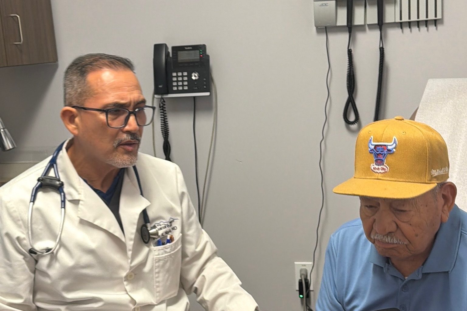 Dr. Jose A. Marin talking with a patient at Transmountain Primary Care in El Paso
