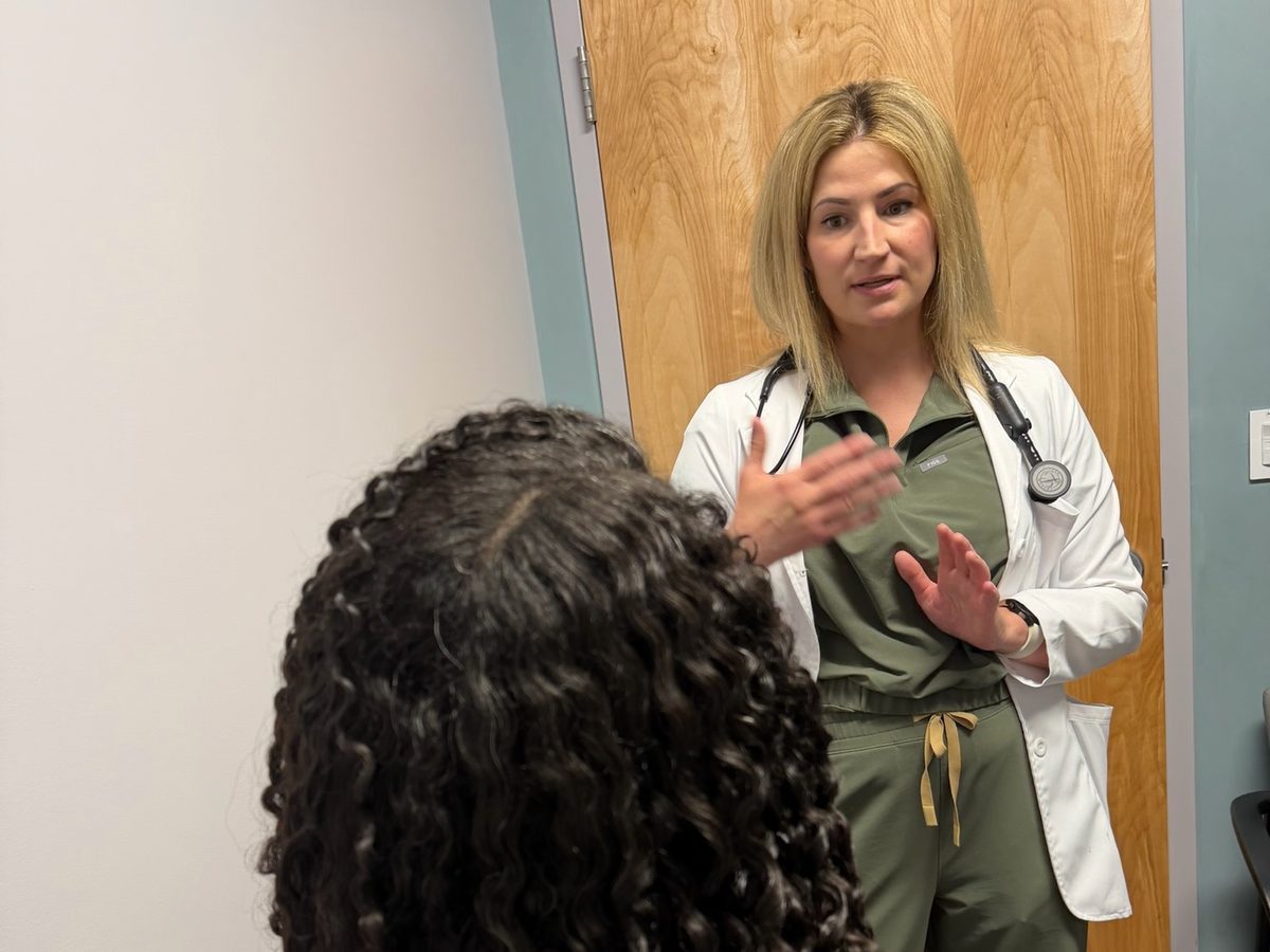 A provider talking with a patient at Transmountain Primary Care in El Paso