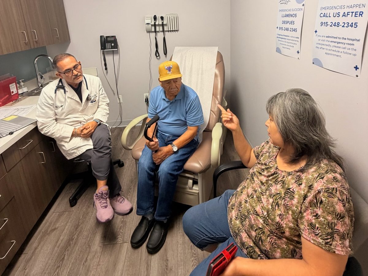 Dr. Jose A. Marin talking with a patient and a family member at Transmountain Primary Care in El Paso