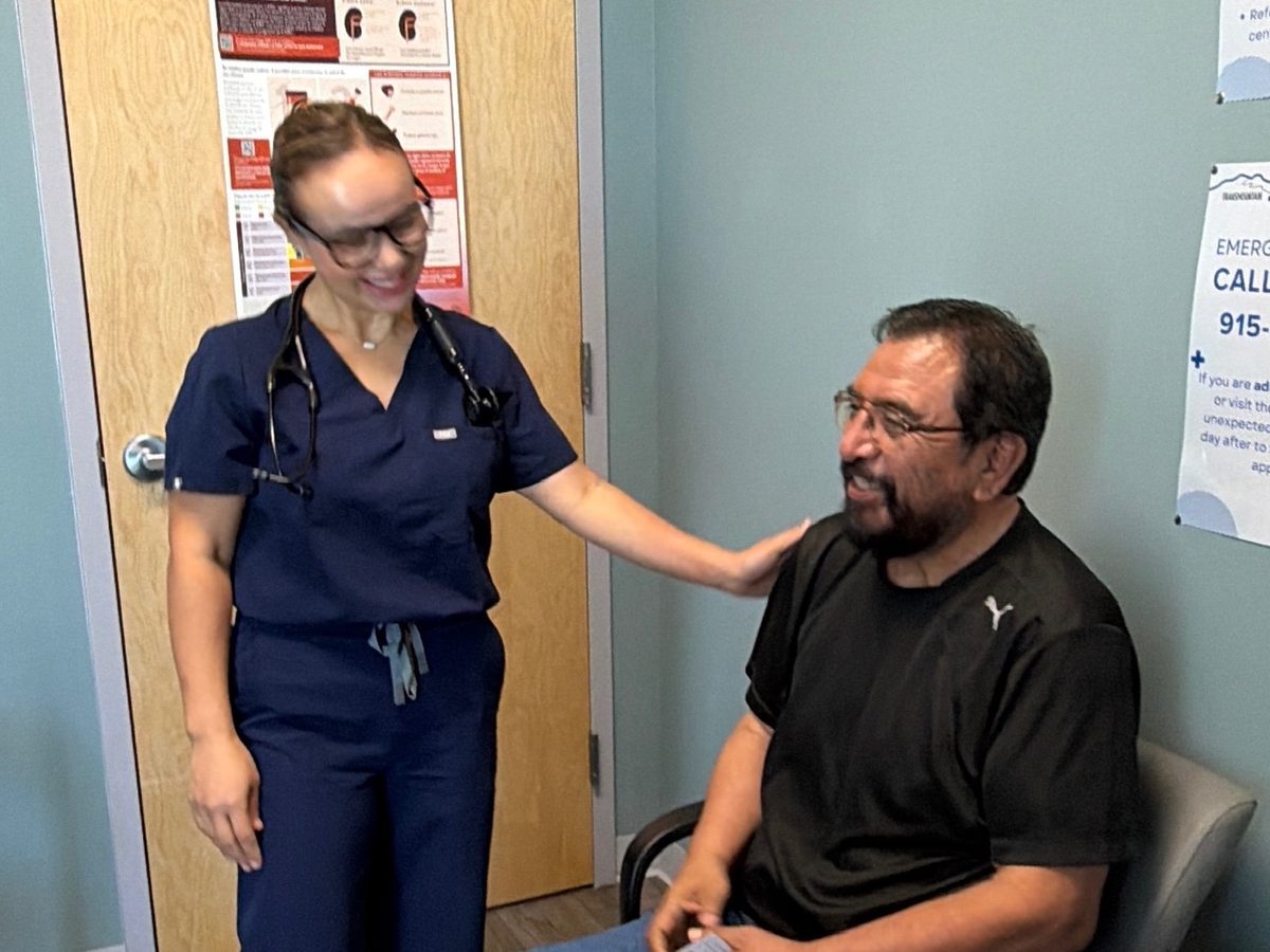 A provider with a patient in an exam room at Transmountain Primary Care in El Paso